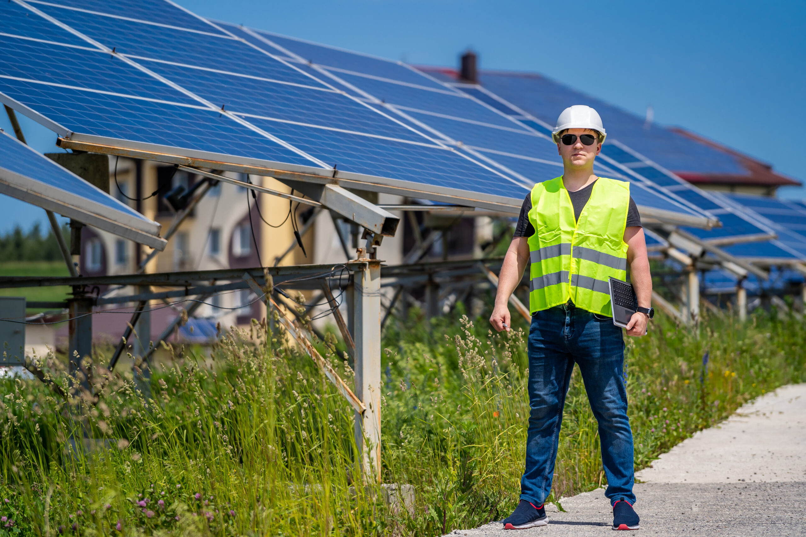 Solar panel companies. Green energy. Electricity. Power energy pannels. Engineer at a solar plant.